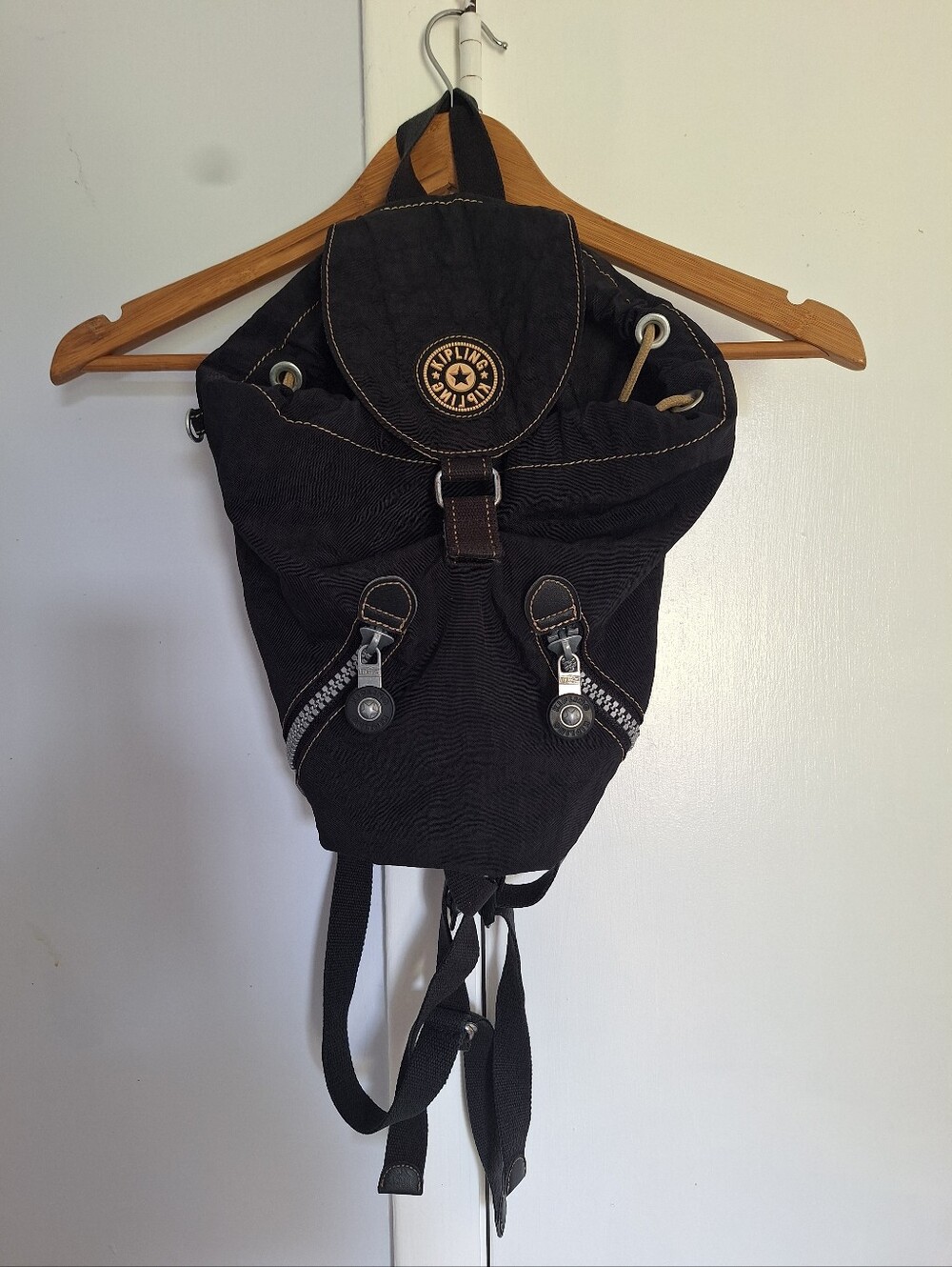Kipling Black Canvas Drawstring Backpack with Handle And Front Zip Pockets